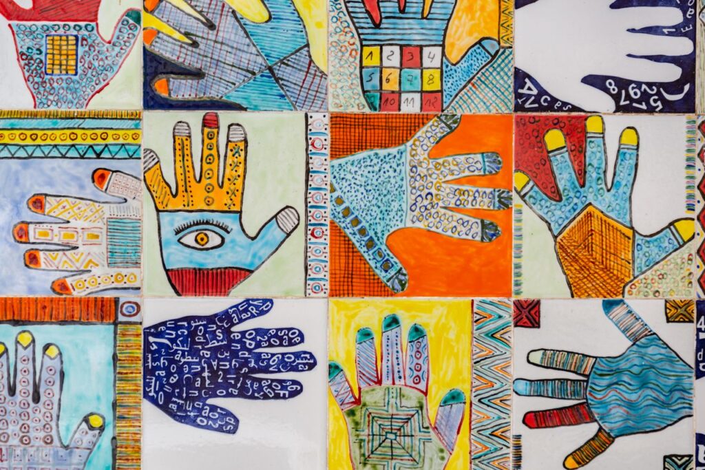 Vibrant collage of hand illustrations featuring geometric patterns on tiles.